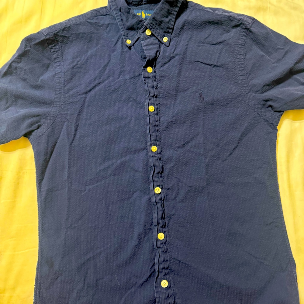 Slightly worn polo, button-down shirt, blue
